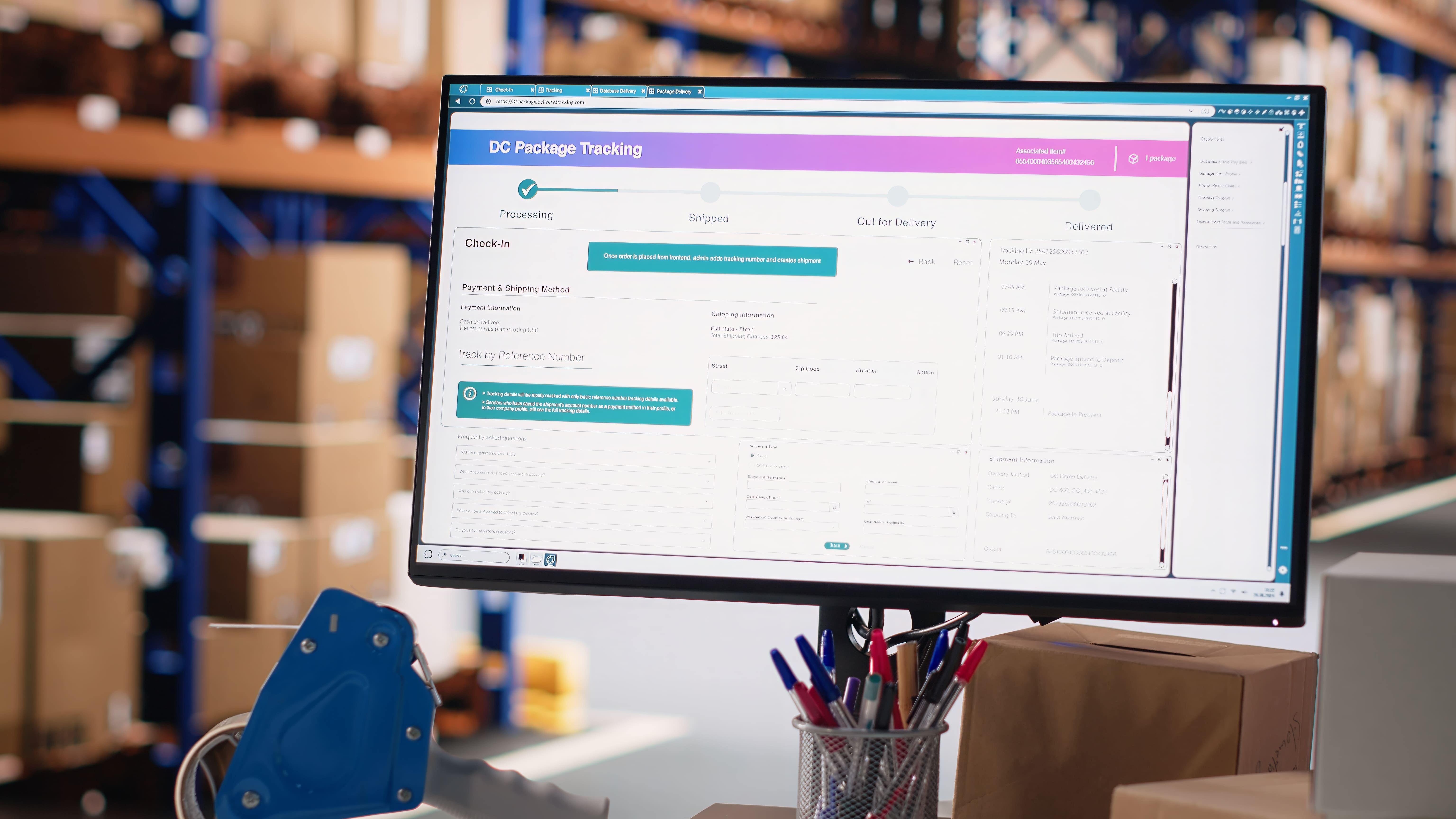 Package tracking dashboard on a monitor at a warehouse packing station